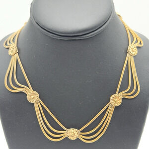 Elegant Gold Necklace with Floral Accents